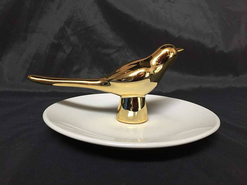 This is a very nice looking ceramic / art pottery trinket dish with gold bird. It would make a lovely gift! Perfect for storing rings, bracelets, small odds and ends, etc. Looks gorgeous on a dresser or end table. It is a good size at approximately 6 inch