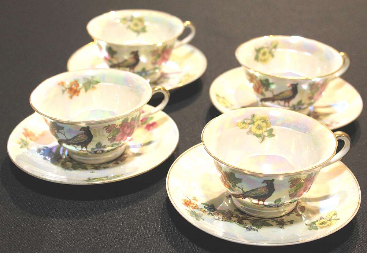 Up for sale are these Rare Vintage Beautiful Czechoslovakia CZE102 Iridescent Set 4 Cups & Saucers. The cups measure approx. 3 7/8"W and 2 1/8"T The saucers are about 5 5/8"W. There are no chips or cracks. There is some minor gold trim