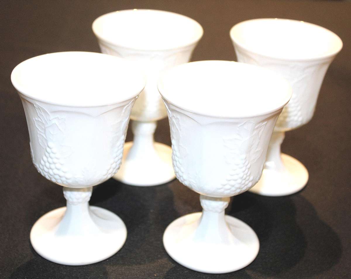Up for sale are these Colony Harvest Milk Glass Set Of Four Water Glasses in excellent condition with no chips or cracks. They measure approx. 5 1/4"T by 3 1/2"W. Shipping Excludes: Alaska/Hawaii, US Protectorates, APO/FPO, PO BoxShipping Prov