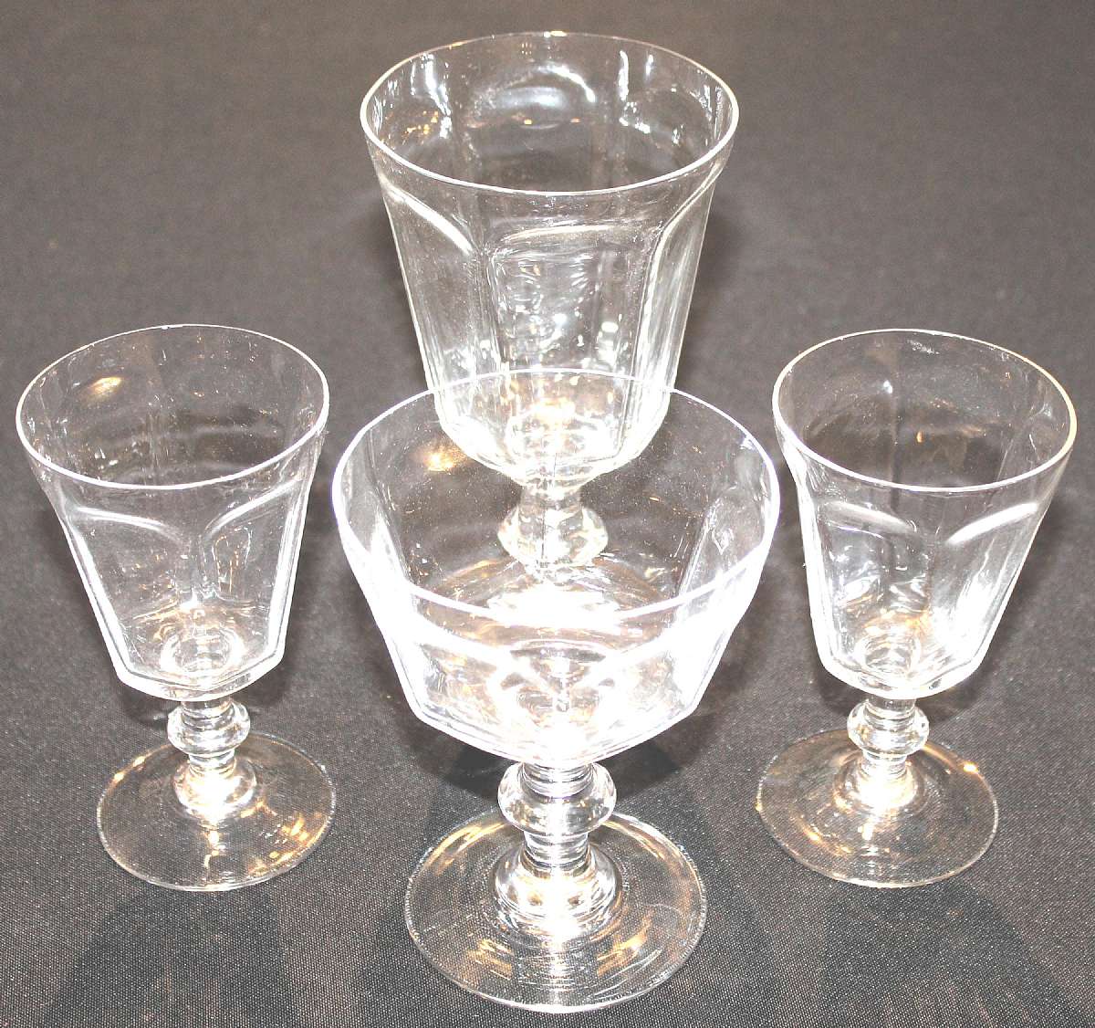 Up for sale are these Lenox Antique Clear Set Of Four Glasses in great condition with no chips or cracks. Included is one 6 3/4"T by 3 5/8"W Water Glass, Two 5"T by2 7/8"W Wine Glasses and One 5"T by 4"W Champagne Glass. They