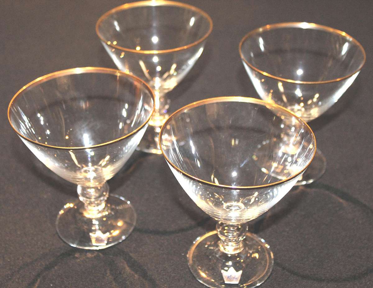 Up for sale are these Kosta Boda Bernadette Sweden Set Of 4 Champagne Glasses Gold Trim in excellent condition with no chips or cracks. They measure approx. 4 1/2" Tall by 4" Wide. They have their original labels that say Kosta Sweden. Shipping