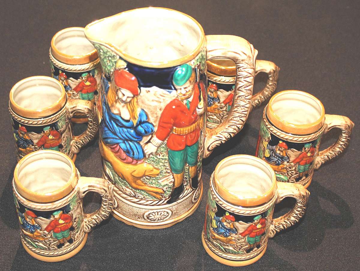 Up for sale are these K T W Beer Pitcher & Six Matching Mugs in great condition with no chips or cracks. The pitcher measures approx. 8 1/2 inches tall and 4 1/2 inches wide at the bottom. The mugs measure approx. 4 inches tall & 2 3/4 inches wide