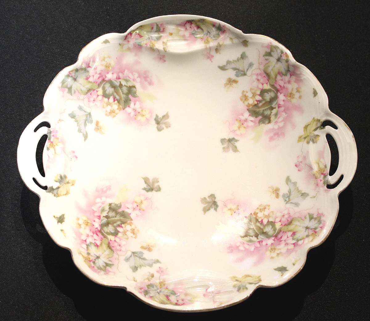 Up for sale is this Antique B. R. C. Racine Bavaria Germany Handled Plate in great condition, some gold wear from use with no chips or cracks or crazing. The plate measure approx. 10 3/4"W and is 1 3/4" Deep. Shipping Excludes: Alaska/Hawaii, U
