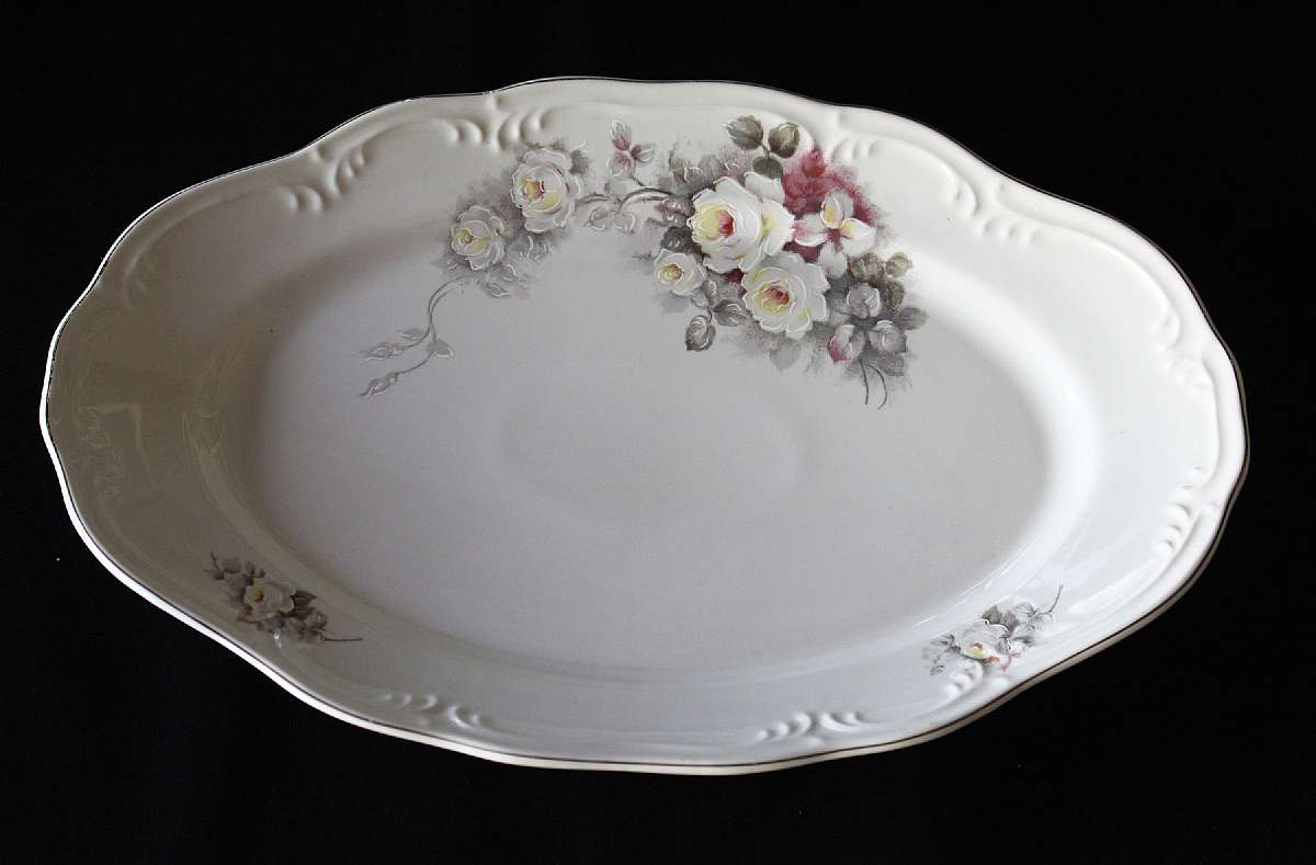 Up for sale is this Schmidt Porcelain White Rose Platter in excellent condition with no chips or cracks. The silver rim probably platinum is excellent as well. The platter measures approx. 15 1/8"L by 9 3/4"W.  Shipping Excludes: Alaska/Hawaii,