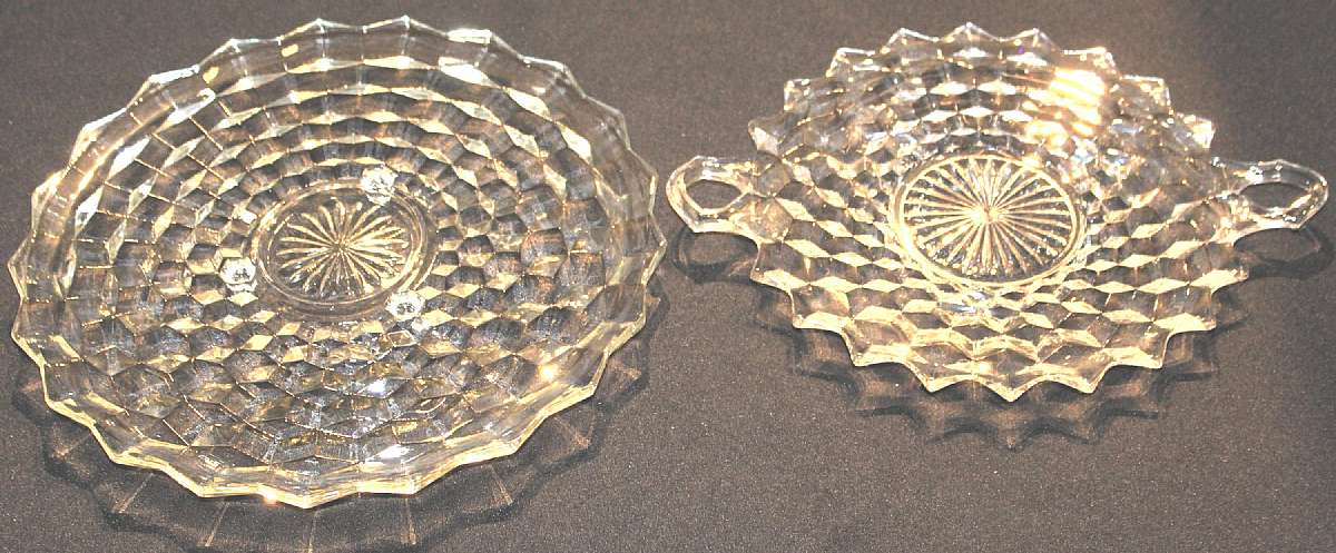 Up for sale are these Fostoria American Three Footed Cake Plate & A Ten Inch Handled Plate in excellent condition with no chips or cracks. The tri-footed measures approx. 12 inches wide & the other one 10 inches. Shipping Excludes: Alaska/Hawaii,