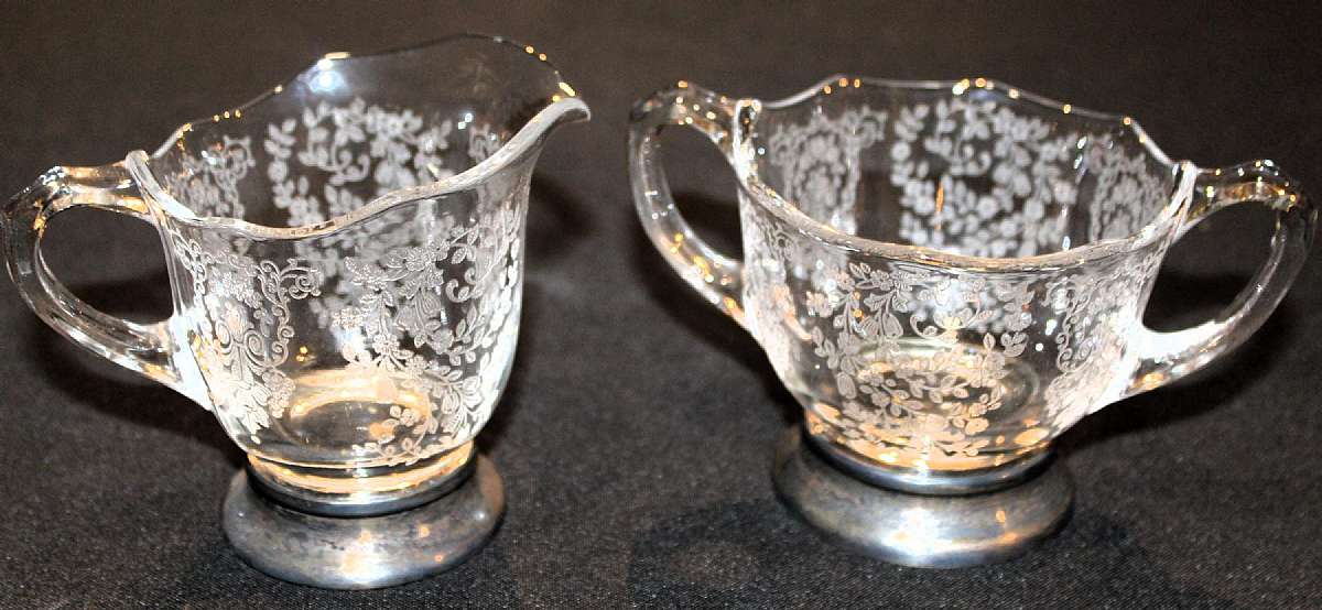 Up for sale are these Rare Duncan & Miller Adoration 3 3/4" Creamer and 3 3/8" Sugar Bowl with Sterling Silver Bases in great condition with no chips or cracks. Beautiful well cared for pieces. Shipping Excludes: Alaska/Hawaii, US Protector