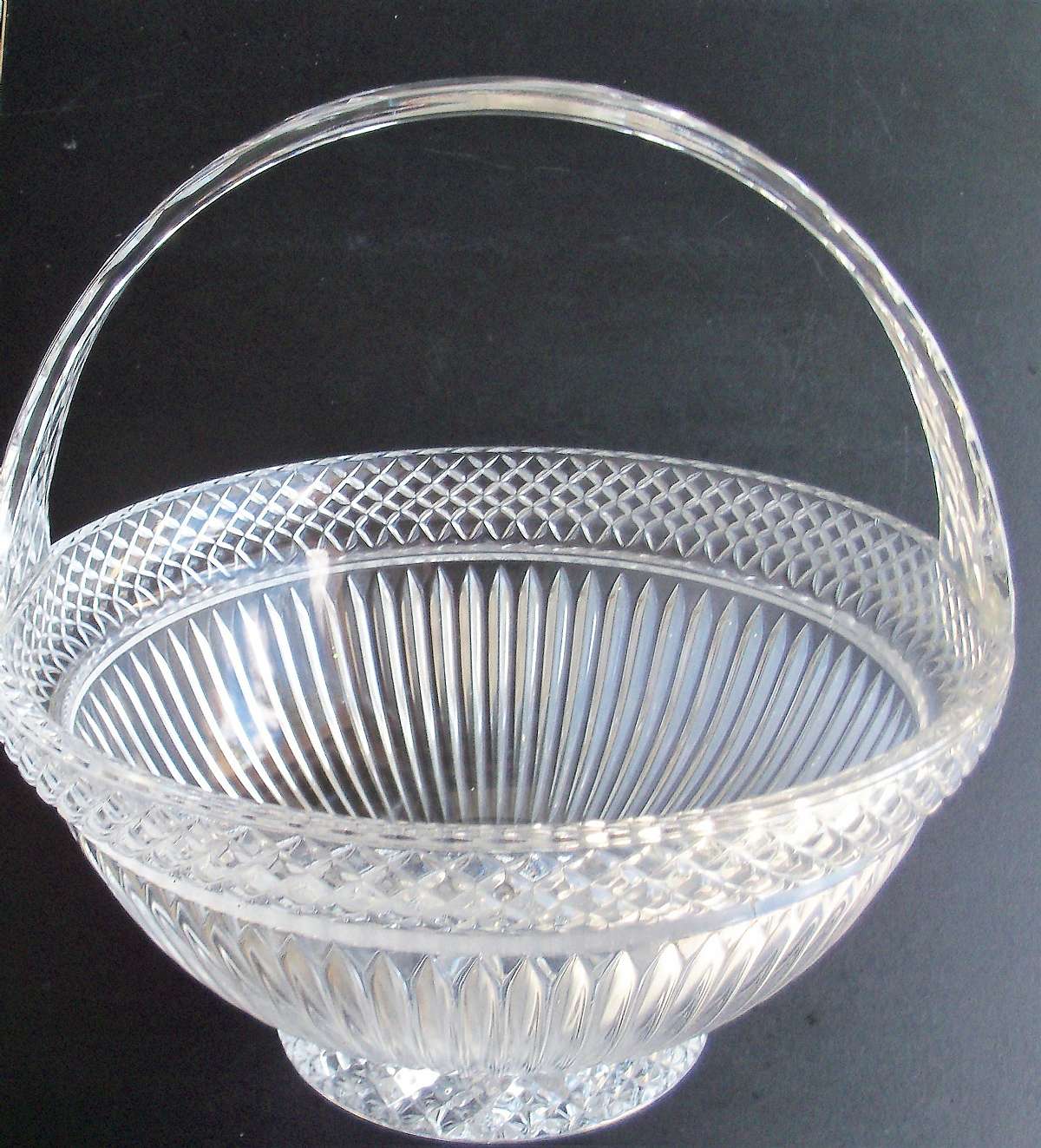 Up for sale is this Fifth Avenue Estate Large Handled Glass Basket in great condition with no chips or cracks. The basket measures approx. 10" W by about 10 1/2"Tall measuring the handle. The basket itself is about 5"Deep.   Shipping Exclu