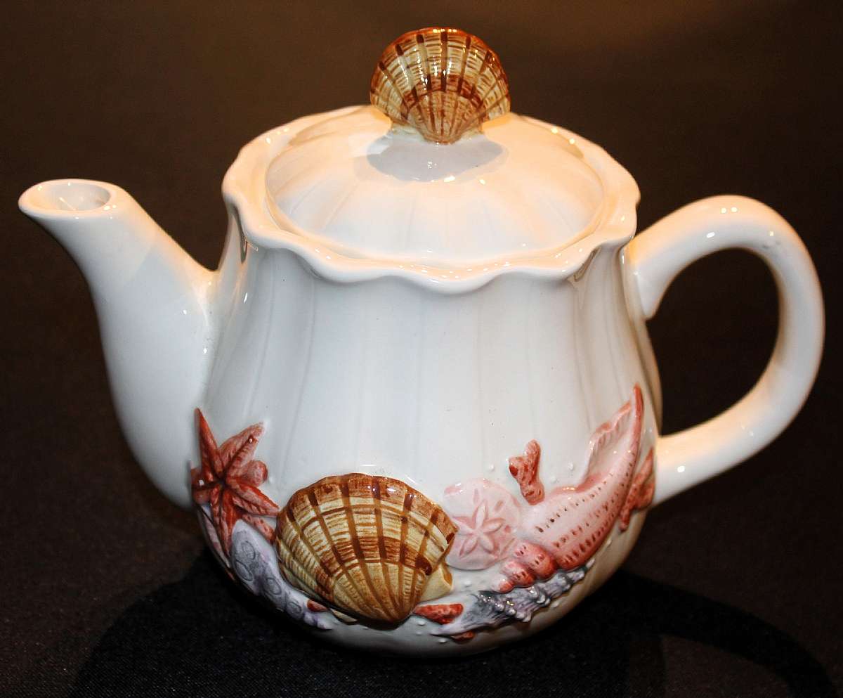 Up for sale is this Otagiri Shell Tea Pot in excellent condition with no chips or cracks. 4 1/2 inches from table to spout. Shipping Excludes: Alaska/Hawaii, US Protectorates, APO/FPO, PO BoxShipping Provided to the United States Only.