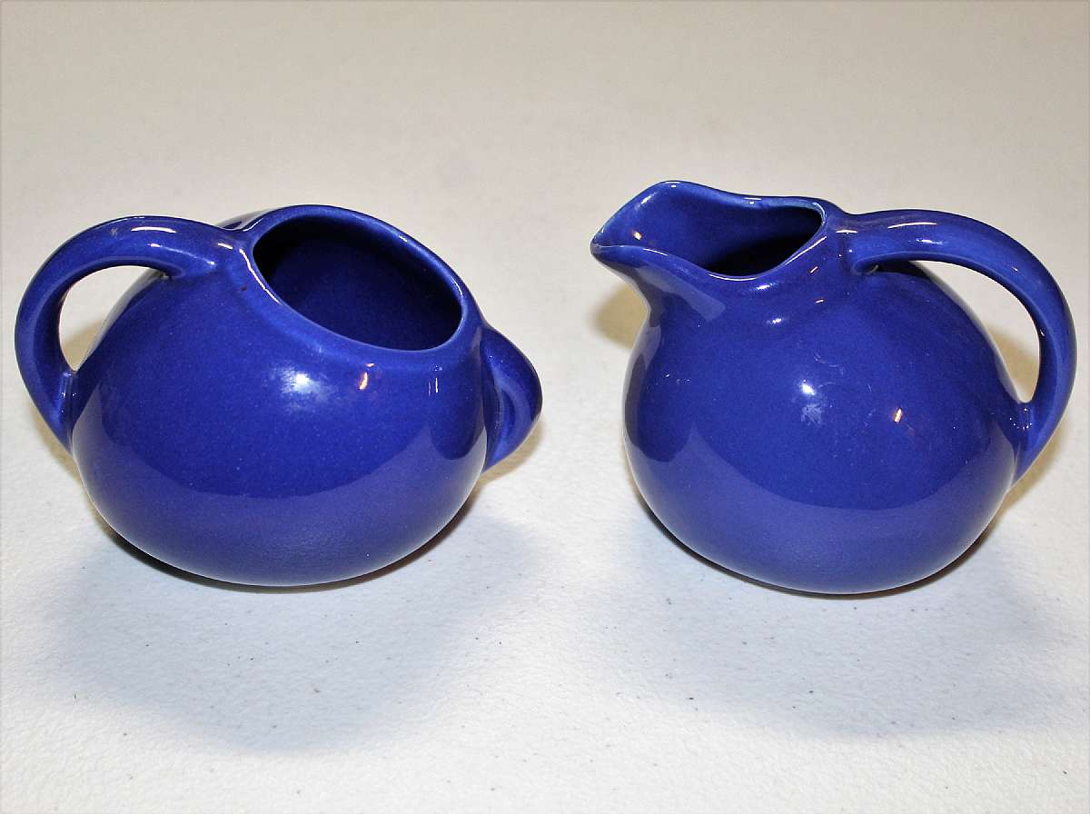 Up for sale are these Vintage Small Blue USA Tilted Ball Creamer Jug Pitcher & Sugar Bowl in great condition with no chips or cracks. They measure approx. 3"T. There is a small glaze imperfection on the lip of the sugar bowl. Shipping Excludes: