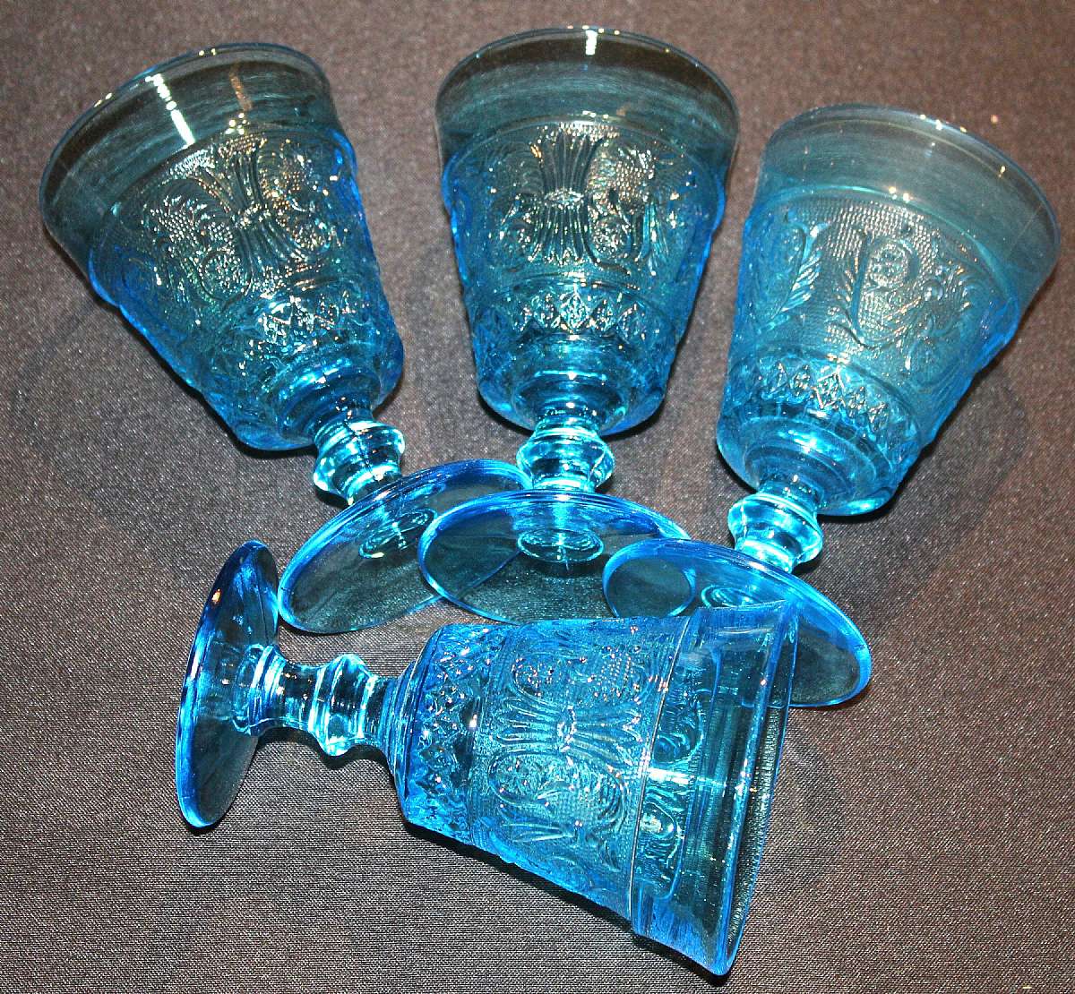 Up for sale are these Four Colony Blue Sandwich Pattern Water Or Iced Tea Glasses in excellent condition with no chips or cracks. The glasses measure approx. 5 5/8"T by 3 3/4"W.  Shipping Excludes: Alaska/Hawaii, US Protectorates, APO/FPO, PO B