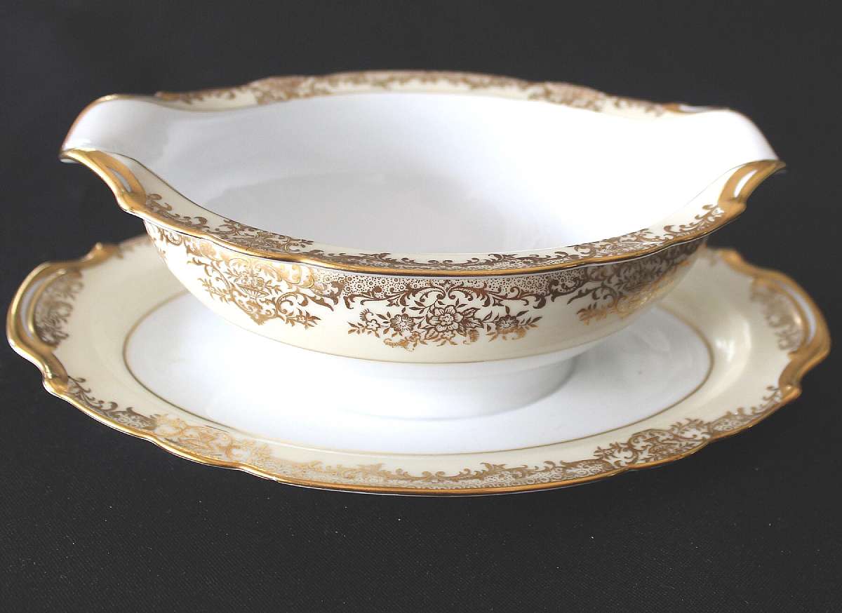 Up for sale is this Noritake Gastonia Gravy Boat With Attached Under Plate in great condition with no cracks. There is minor gold wear and a very small flee bite on the underside which is picture in the last photo.   Shipping Excludes: Alaska/Hawaii, US