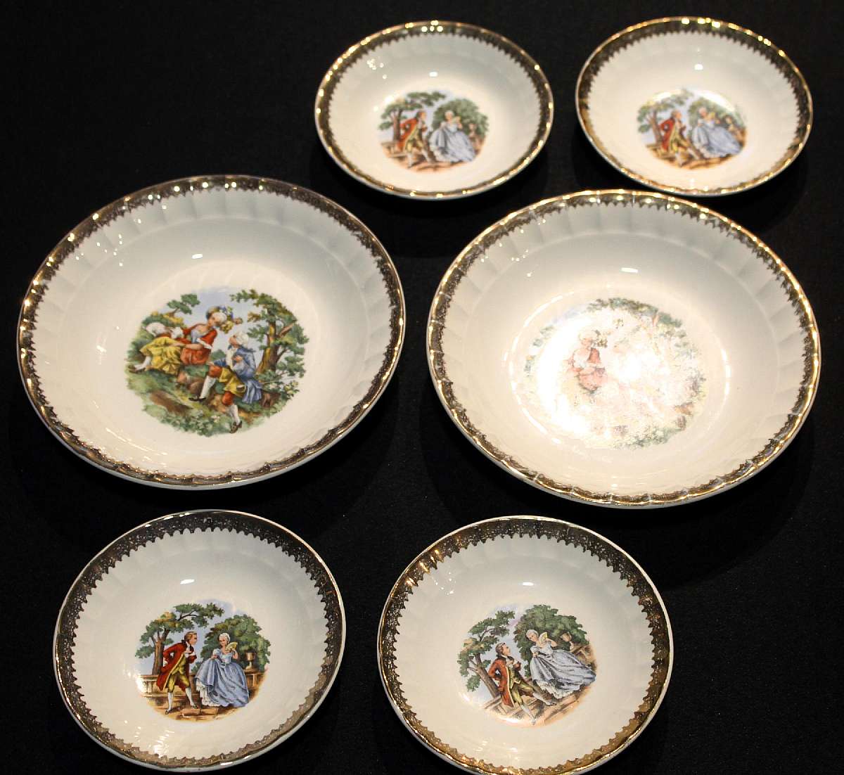 Up for sale are these Prim Rose China Loving Couple set of 4 Fruit Bowls & 2 Soup Bowls With Gold Trim in excellent condition with no chips or cracks or crazing. The Fruit bowls measure approx. 5 1/8"W and the soup bowls 7 5/8"W.  Please see
