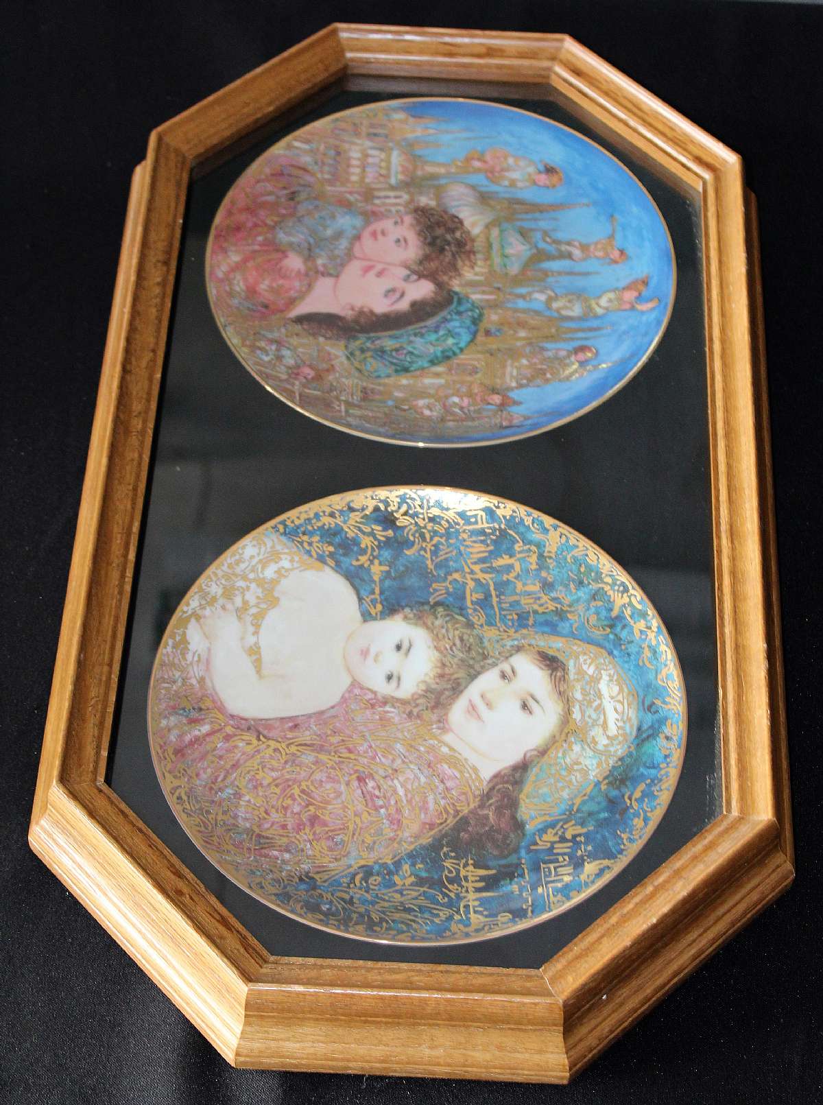 Up for sale are these Edna Hibel Studio Plates In A Double Oak Bards Plate Frame. Included, one 9 1/4" And Unto Us a Child Is Born Plate number 1149, one 9 1/4" Holiday Joy Plate number 5797 and one Bard's Oak Double Plate Frame that measures approx. 23 1