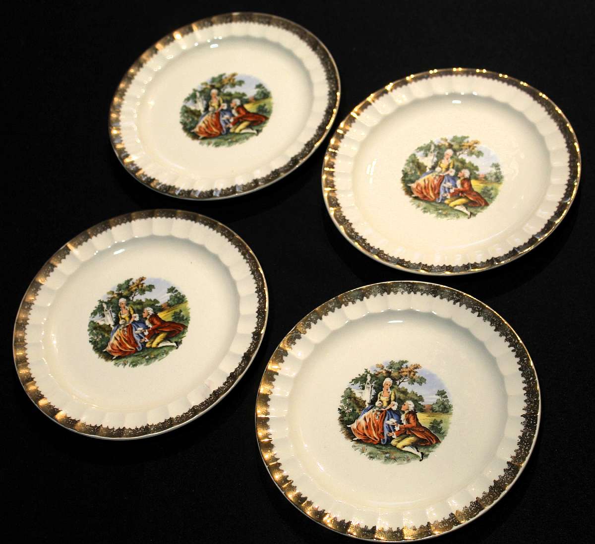 Up for sale are these Prim Rose China Loving Couple set of 4 Salad Plates With Gold Trim in excellent condition with no chips or cracks or crazing. They measure approx. 7 1/4"W. Please see my other sales for more of this rare pattern. Shipping Excl
