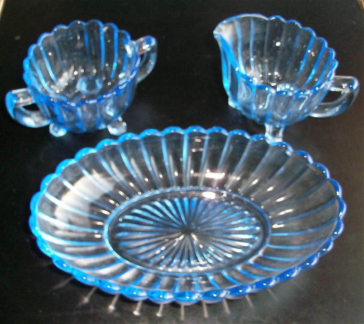 Up for sale are these Pillar Flute Blue by Imperial Glass-Ohio Creamer and Sugar Bowl & Oval Bowl in great condition with no chips or  cracks. The oval bowl measure approx. 8"L by 5"W, the creamer 3 1/8â€T and the sugar 3