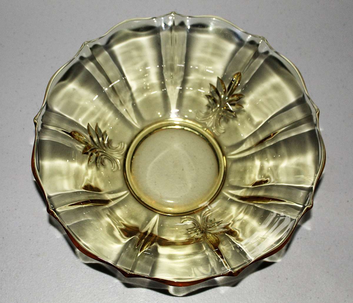 Up for sale is this Vintage Yellow Glass Bowl With A Fleur De Lis Design in excellent condition with no chips or cracks. The Bowl measures approx. 11"W by 3 3/4"T.Shipping Excludes: Alaska/Hawaii, US Protectorates, APO/FPO, PO BoxShipping Prov