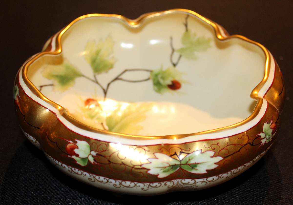 Up for sale is this Beautiful Vintage Stunning Hand Painted Marked Footed Bowl. I cannot read the maker's name. The bowl measures approx. 8 1/2"W by about 3"T. Shipping Excludes: Alaska/Hawaii, US Protectorates, APO/FPO, PO BoxShipping Provide