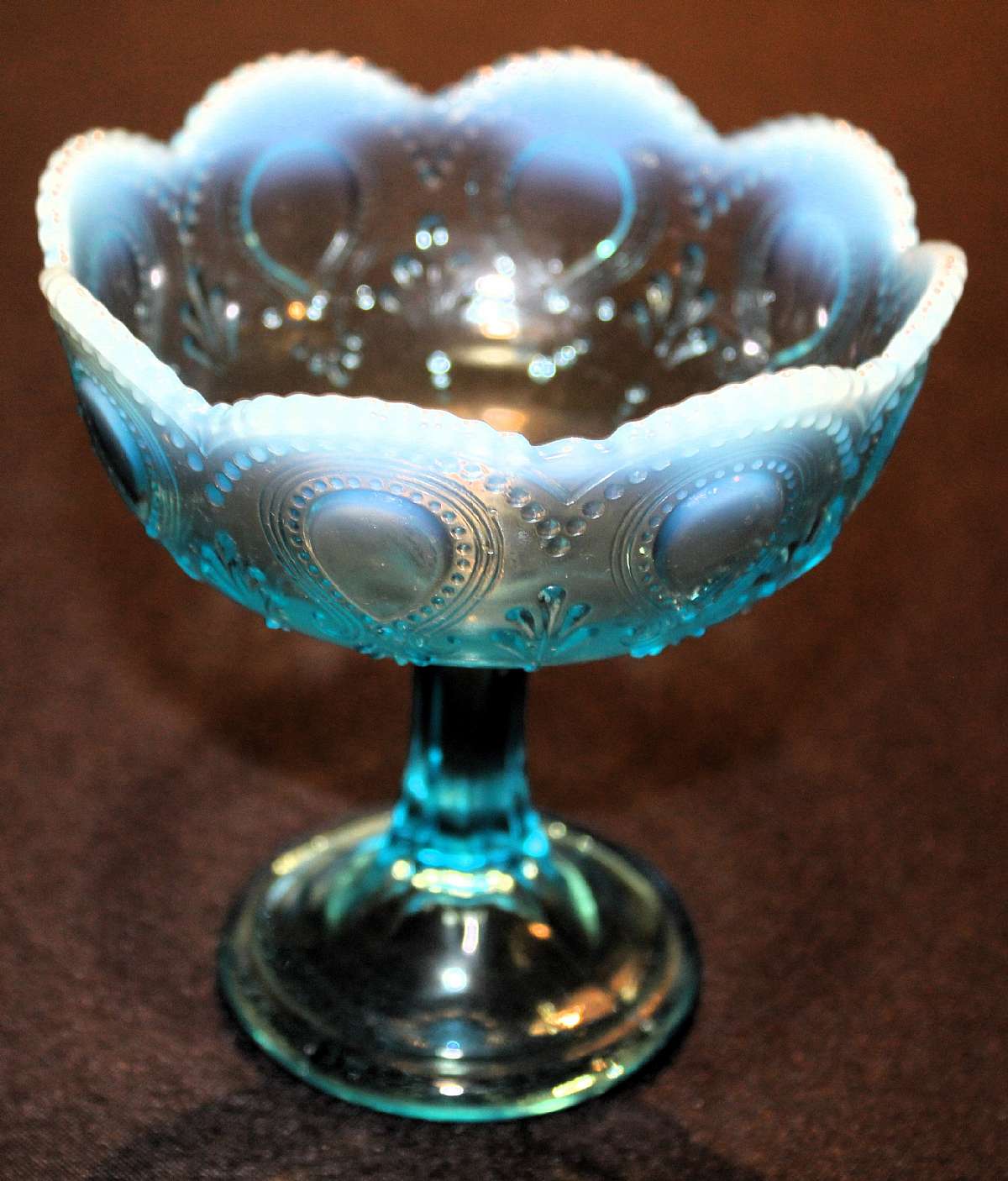 Up for sale is this Blue Opalescent Art Glass Footed Compote in great condition with no chips or cracks..Has a scratch on the inside.  It measures approx. 5"T by 4 3/4"W. Beautiful Piece.  Shipping Excludes: Alaska/Hawaii, US Protectorates, APO