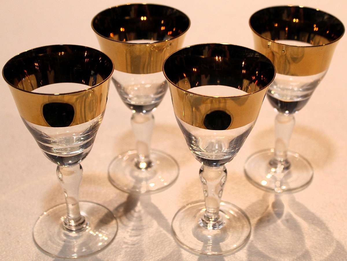Up for sale are these Avitra Golden Set Of Four Cordial Glasses in great condition with no chips or cracks. They measure approx. 4 1/2"T by 2 3/8"W.  Shipping Excludes: Alaska/Hawaii, US Protectorates, APO/FPO, PO BoxShipping Provided to the U