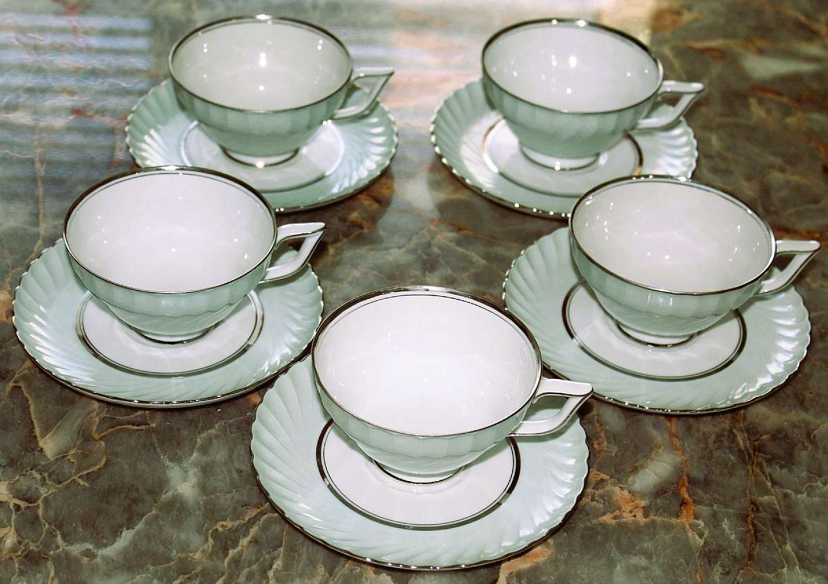 Up for sale are these Rare Royal Tettau South Wind Grey Green Set Of Five Cup & Saucer Sets in excellent condition with no chips or cracks. The cups measure approx. 2 1/4"T and the saucers 6 1/8"W.  Please see my other sales for more of this