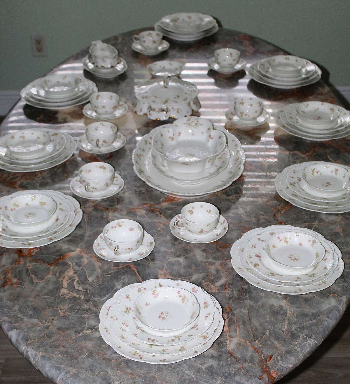 Up for sale is this Antique Haviland & Company Limoges France 58 Piece Dinnerware Set in fantastic condition. This is a rare set that includes eight 5 1/2"W Saucers, SEVEN cups that measure 2"T by 3 1/2"W, ten 5"W Fruit Bowls, eight 7 5/8""W plates, Ten 8