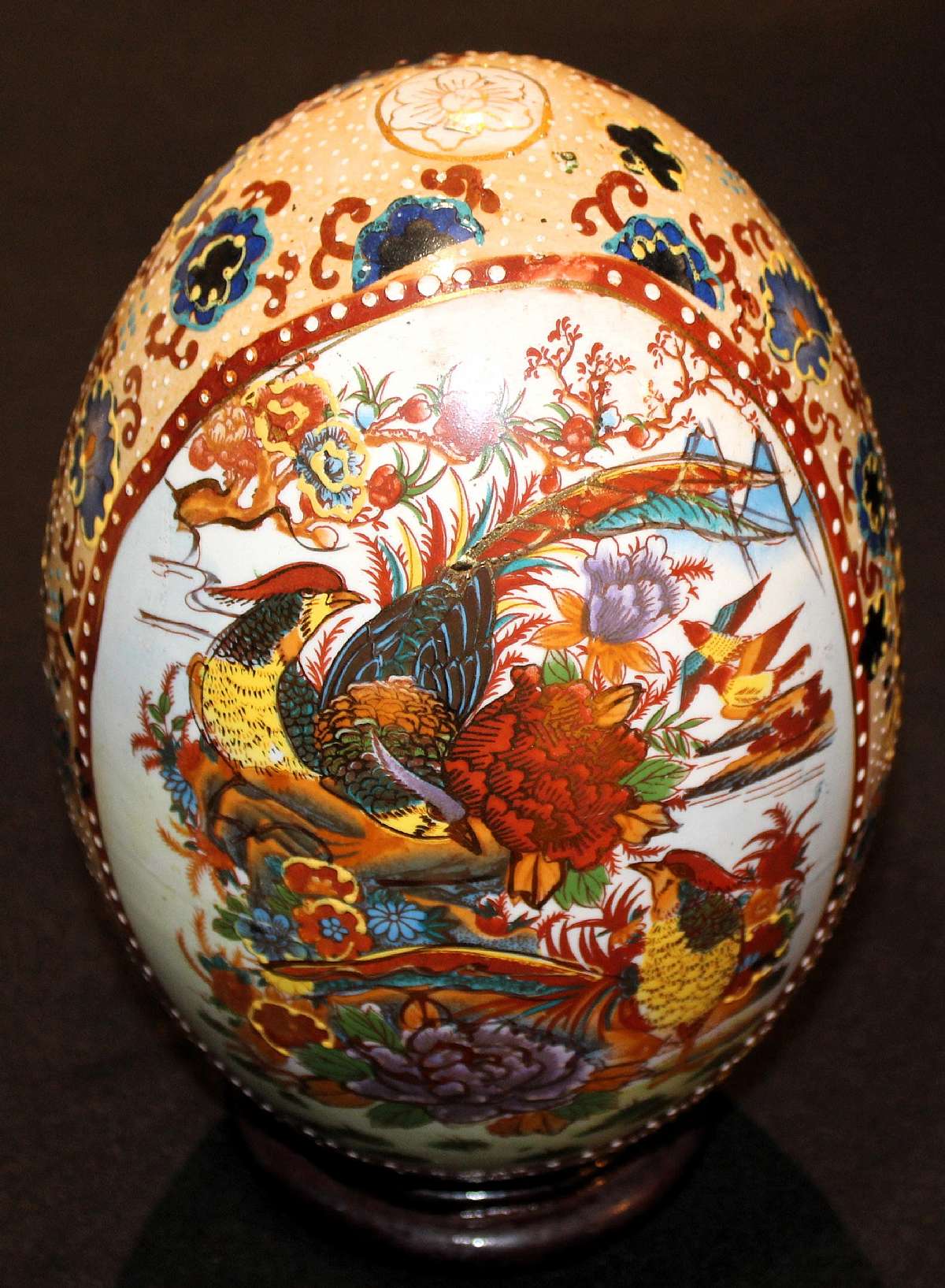 Up for sale is this Antique Highly Decorated Pottery Egg With Bird Design in Great Condition with no chips or cracks. It measures approx. 10 1/4"T . Highly decorated Item with enamel and gold. Comes with the wood stand.Shipping Excludes: Alaska/Hawa