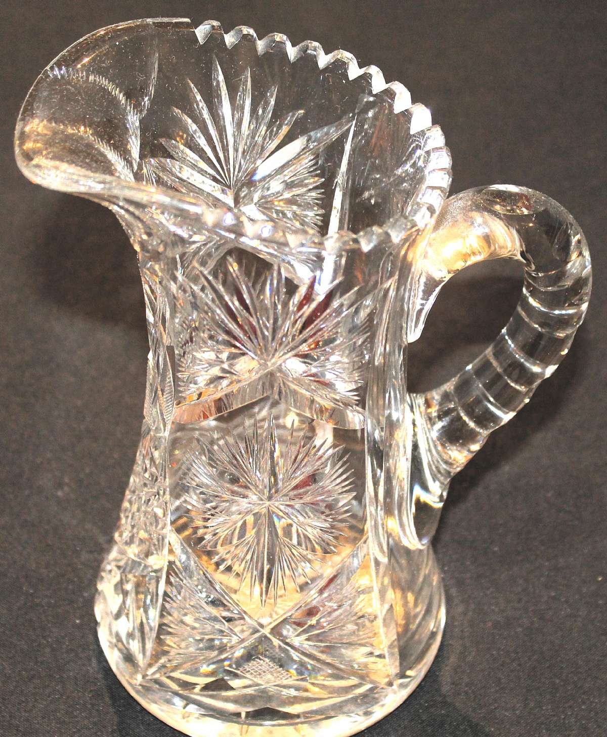 Up for sale is this Vintage Beautiful Large Glass Pitcher in excellent condition with no chips or cracks. It measures approx. 9 1/8"T by 5 1/4"W at the bottom.  Shipping Excludes: Alaska/Hawaii, US Protectorates, APO/FPO, PO BoxShipping Provid