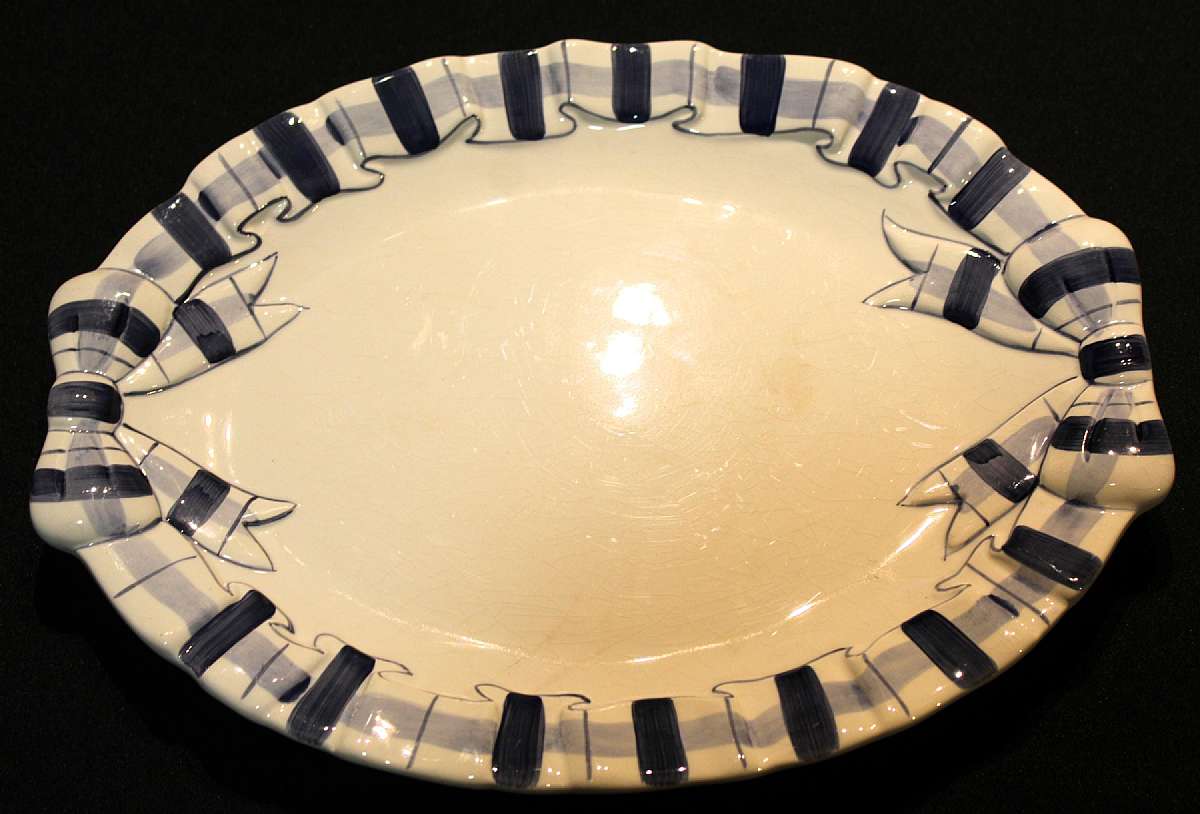 Up for sale is this Haldon Blue Plaid Fifteen Inch Platter in good condition with no chips. There is crazing. The Platter measure approx. 15"L by 11 3/4"W. Shipping Excludes: Alaska/Hawaii, US Protectorates, APO/FPO, PO BoxShipping Provided to