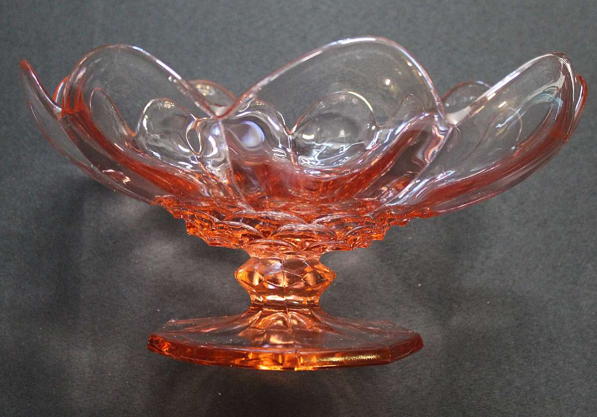 Up for sale is this Vintage Mckee Colonial Pink Beautiful Compote in excellent condition with no chips or cracks. The Compote measures approx. 12"W by 6"T.Shipping Excludes: Alaska/Hawaii, US Protectorates, APO/FPO, PO BoxShipping Provided to