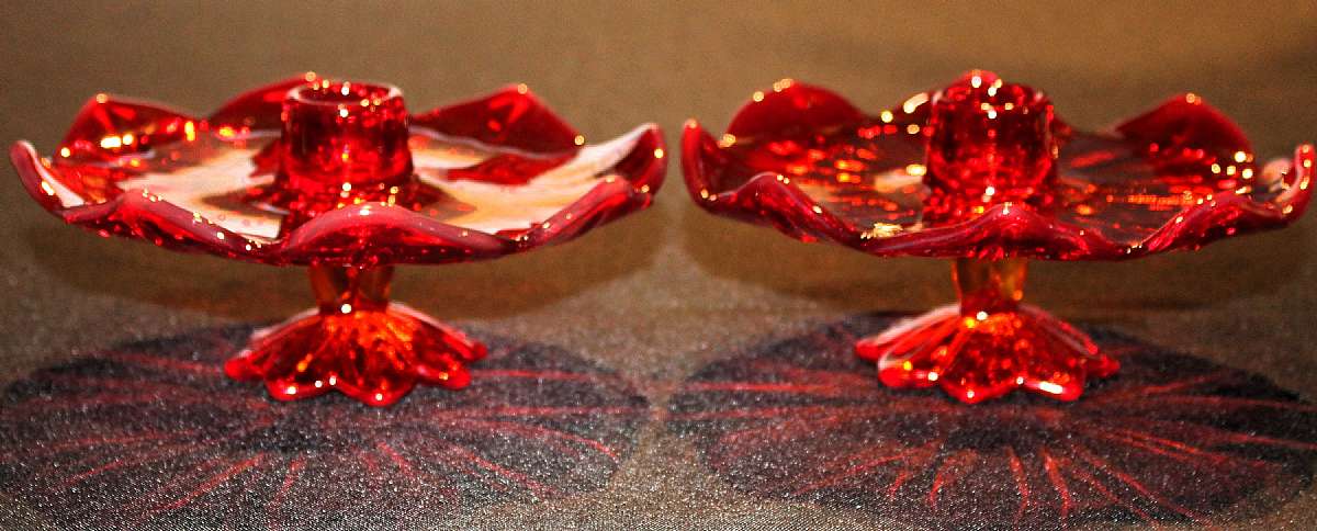 Up for sale are these pair of Ruby Red Footed Candlestick Vintage Glass Candle Stick Holders in great condition with no chips or cracks. They measure approx. 2 1/2 inches tall and about 6 1/4"W.  Shipping Excludes: Alaska/Hawaii, US Protectorates, A